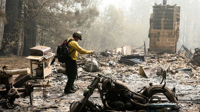 Firefighters battle exhaustion along with wildfire flames