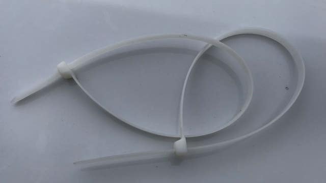 Suspects accused of binding people with zip-ties, firing shots on property full of stolen items