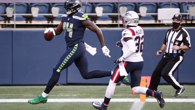 Tyler Lockett of the Seattle Seahawks waits for a timeout during a News  Photo - Getty Images