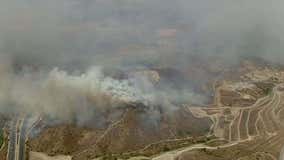 Fast-moving wildfire forces evacuation of over 90,000 in Southern California