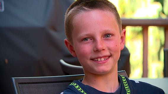 Seahawks huddle around Mercer Island boy who beat cancer