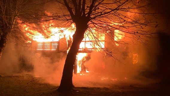 Woman jumps out of burning University Place apartment; fire investigated as arson