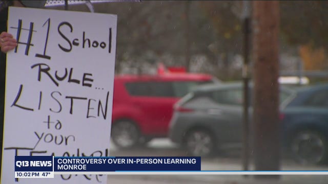 Monroe parents and teachers rally against some students returning to in-person hybrid learning