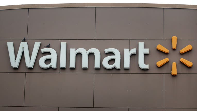 A sign hangs outside of a Walmart store on May 19, 2020 in Chicago, Illinois. (Photo by Scott Olson/Getty Images)