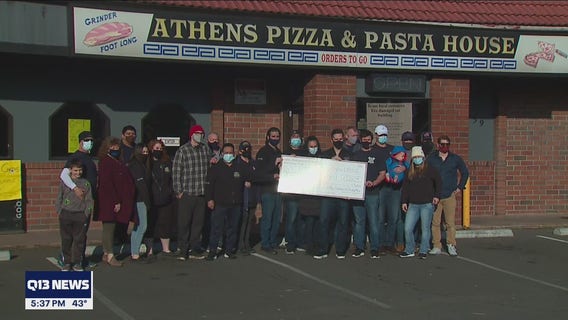 Local firefighters present $1000 check to help beloved restaurant that burned in a fire
