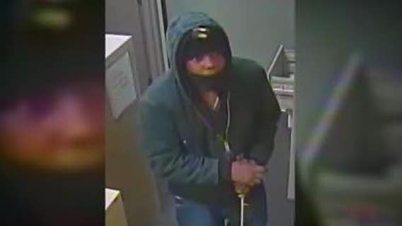 Help ID bank burglar who smashed-out front glass door, only got away with rolled coins