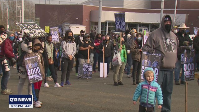 Crowds wear masks to march in Seattle honoring legacy of Dr. Martin Luther King Jr.