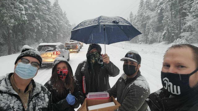Oregon health workers stuck in snow give other drivers COVID-19 vaccine