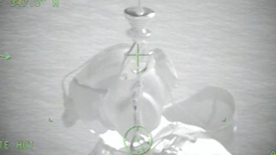 Coast Guard air crew rescues hikers on coastal ledge