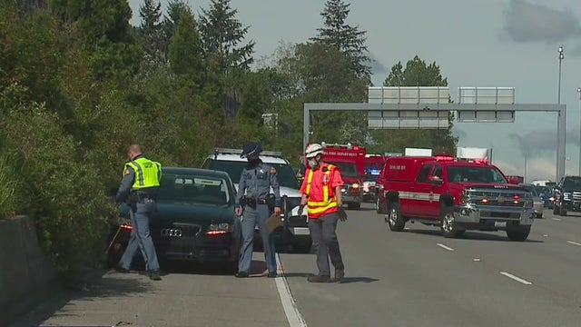 Woman arrested for vehicular homicide after hitting, killing person changing tire on I-5 in Tacoma