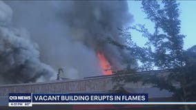 University District vacant building burns, police seek person of interest