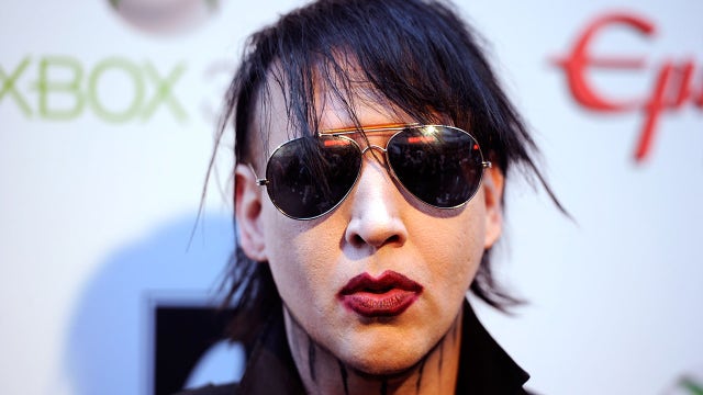 Marilyn Manson turns himself in to police over assault warrant