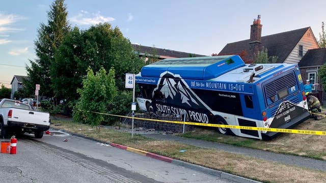 Tacoma transit bus crashes into front yard, at least one person sent to the hospital