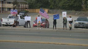 Demonstrating against vaccine mandates as Pfizer’s COVID shot gains FDA approval