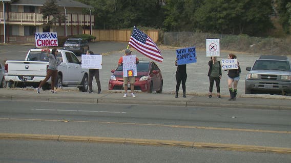 Demonstrating against vaccine mandates as Pfizer’s COVID shot gains FDA approval