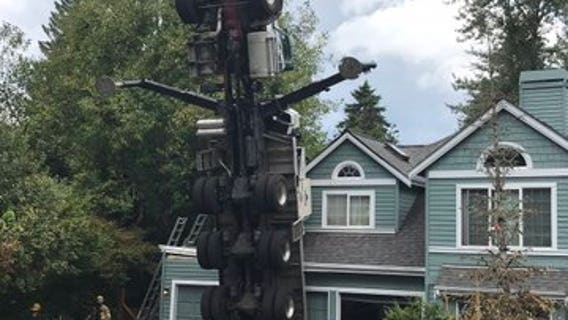 2 workers hurt when crane collapses onto house in Issaquah