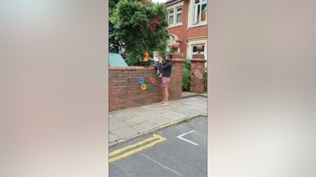 Children recreate Olympic torch relay in UK streets