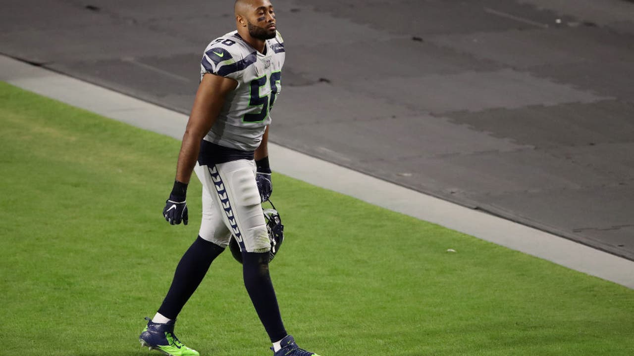 Outside linebacker K.J. Wright of the Las Vegas Raiders tries to