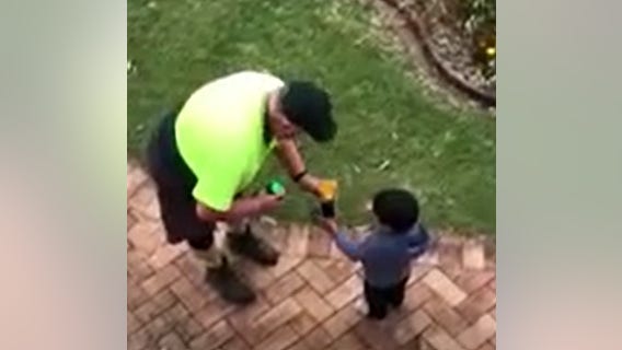 Sanitation worker, boy trade gifts in mutual acts of kindness