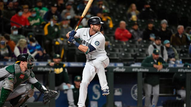 Haniger hits 2 HRs, M's beat A's to gain in wild-card race