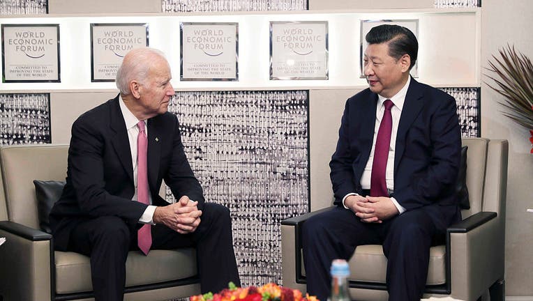 FILE - Chinese President Xi Jinping (R) meets with U.S. Vice President Joe Biden in Davos, Switzerland, on Jan. 17, 2017. (Xinhua/Lan Hongguang via Getty Images)