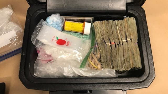 Guns, drugs, nearly $10,000 in cash recovered from stolen trailer