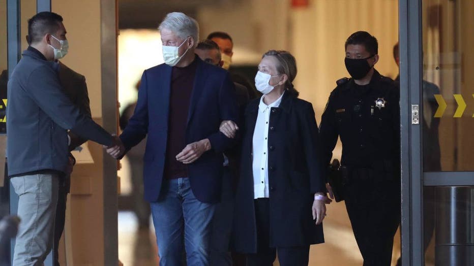 Former President Bill Clinton, standing with his wife, Hillary, was discharged from UC Irvine Medical Center Sunday morning, six days after he was admitted and treated for a urological and blood infection.