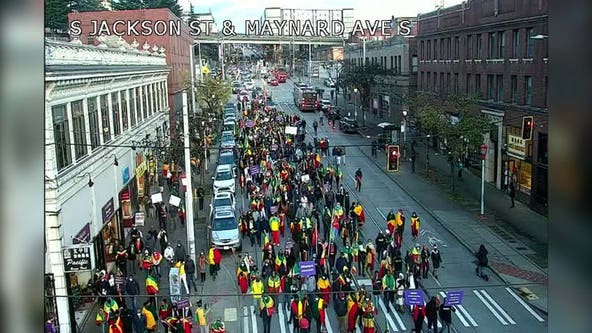 Protestors march through downtown Seattle