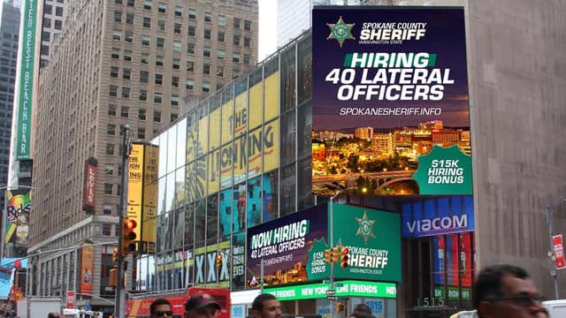 Spokane County sheriff launches campaign to recruit officers with misspelling on Times Square billboard