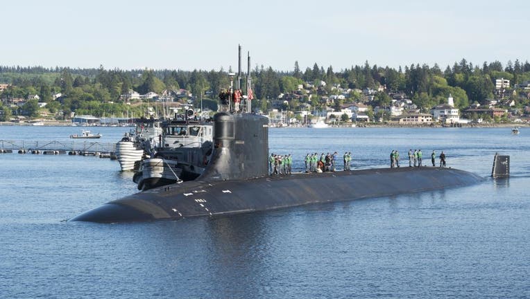 FILE - Photograph of submariners standing on top of the Seawolf-class fast-attack submarine USS Connecticut in the water at Naval Base Kitsap-Bremerton on May 7, 2018. (Photo by Smith Collection/Gado/Getty Images)