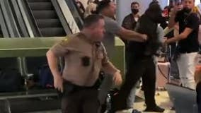 Massive brawl breaks out at Miami airport, suspects nabbed after biting cop's head