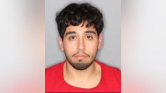 Robbery suspect spotted changing stolen tires, fails to escape in jacked up car