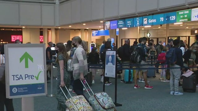Millions scramble for destinations as flight cancelations pile up