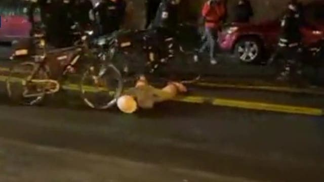Seattle police officer who rolled bike over protester's head gets 7-day suspension