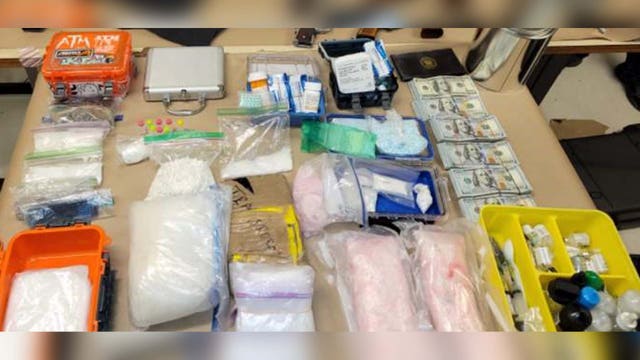 Seattle Police arrest drug trafficking suspect, seize guns and pounds of drugs