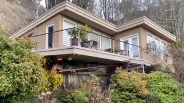 Seattle firefighters rescue man trapped in home that slid off its foundation
