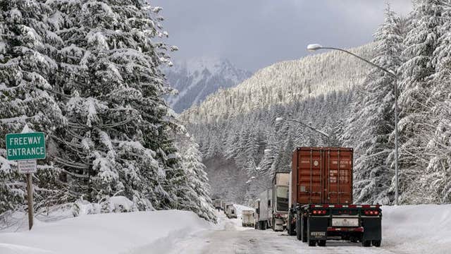 PHOTOS: Snow piles up at levels not seen in decades at Snoqualmie Pass
