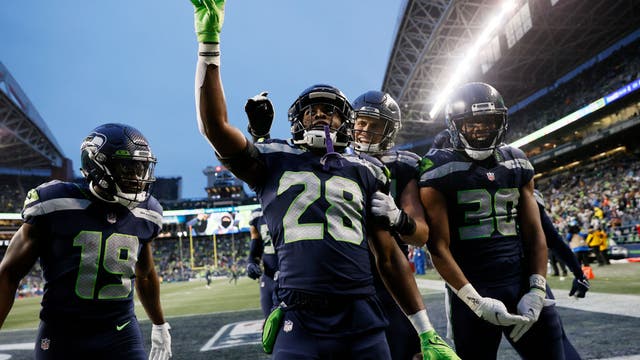 Penny, Metcalf lead Seahawks to 51-29 blowout of Lions