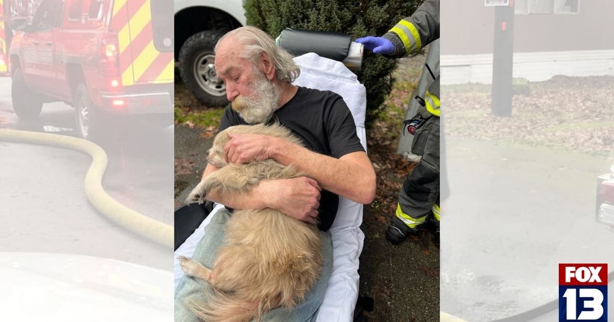 VIDEO: Man tries to run back into burning home to save dog, firefighter ...
