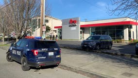 Bank employee shot during robbery; Seattle police searching for armed suspect