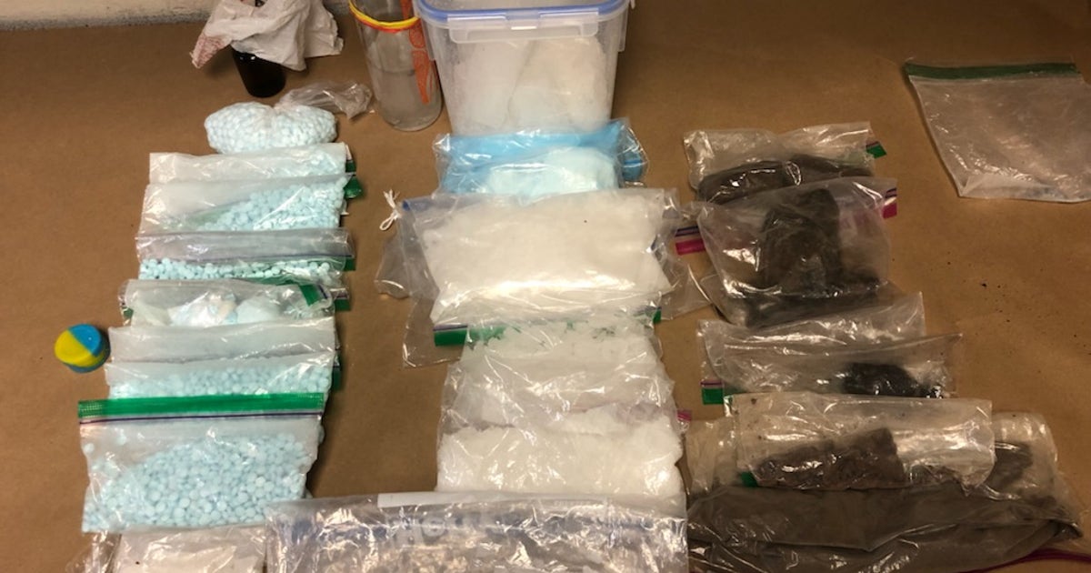 Police recover stolen gun, more than $35K in cash and drugs in ...