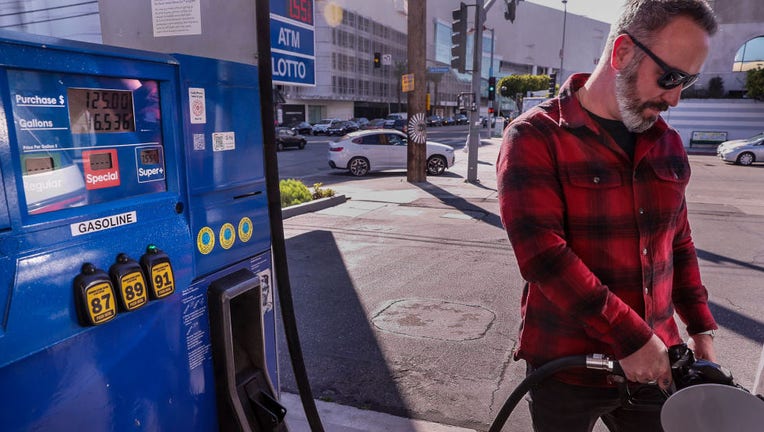 Man pumps gas in California