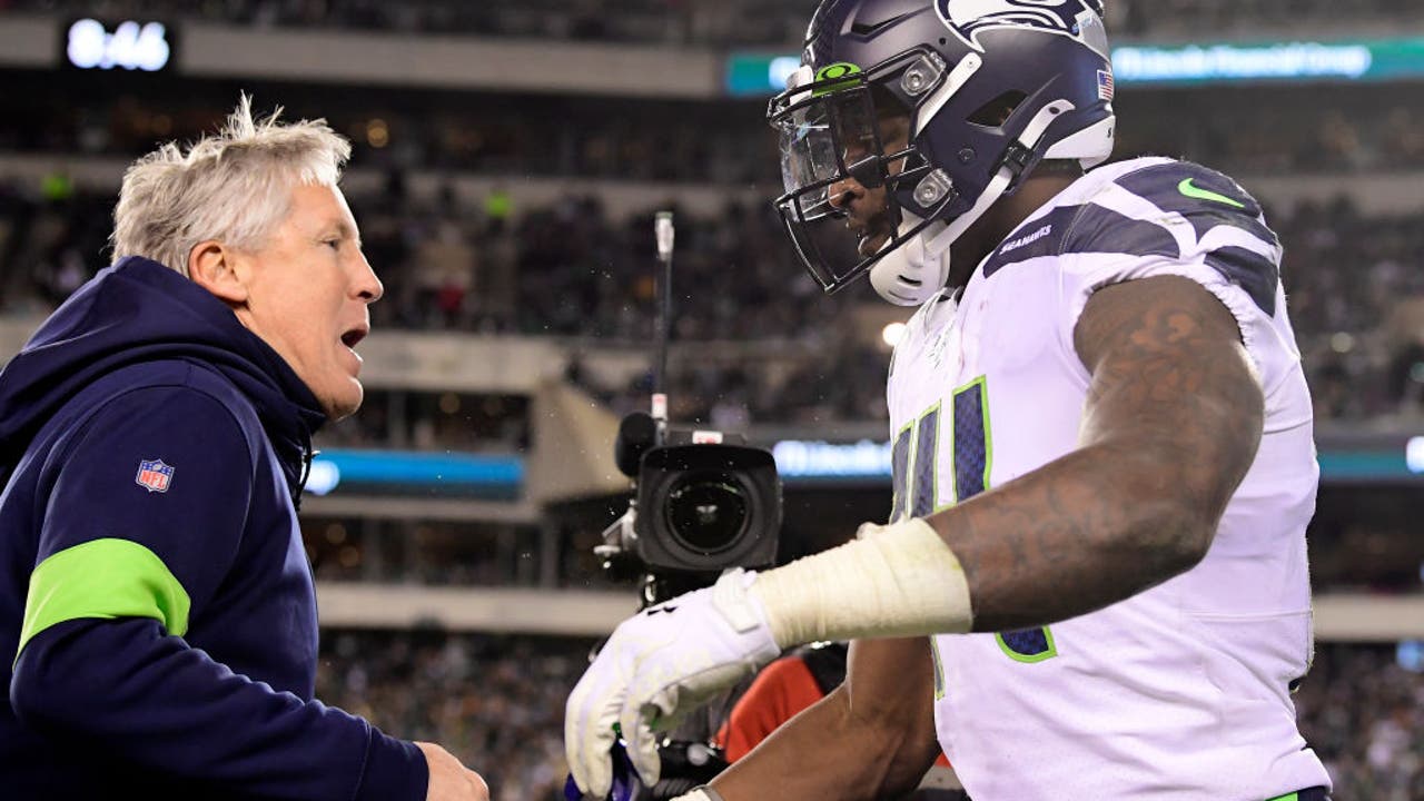 Pete Carroll Takes His Shirt Off To Meet D.K. Metcalf