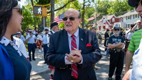 Rudy Giuliani slapped by supermarket employee while campaigning for son