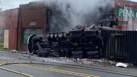 Semi crashes into building, catches fire near Oak Harbor