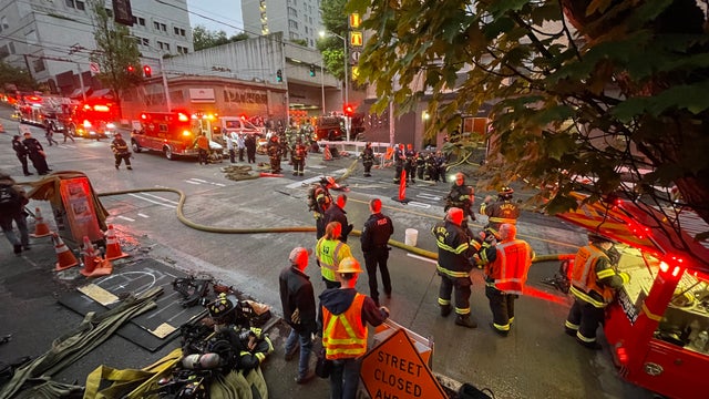8 residents rescued from three-alarm fire in Seattle