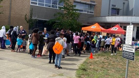 Students form long lines for 'Back2School Bash' backpack giveaway
