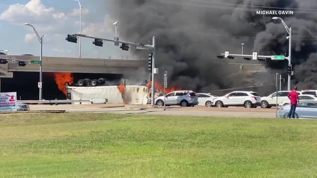18-wheeler flips over barrier on US-75 overpass in Fairview, driver killed