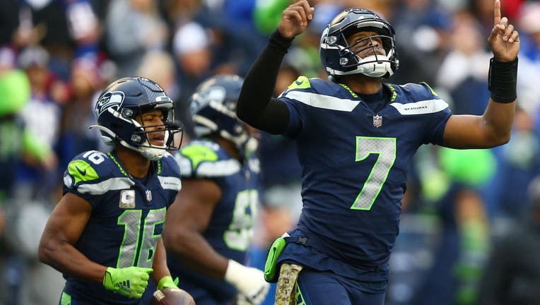 Seattle Seahawks quarterback Geno Smith (7) holds the ball while