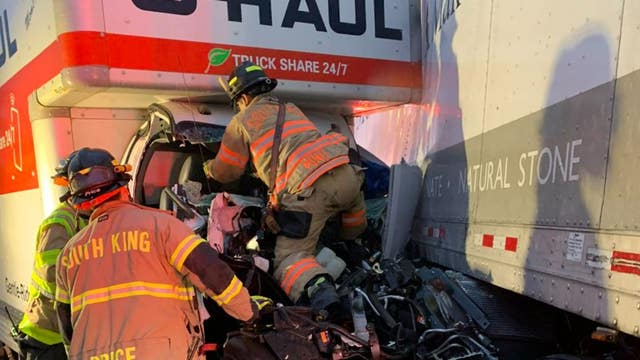 PHOTOS: Crews use Jaws of Life to rescue driver from crashed U-Haul in Federal Way